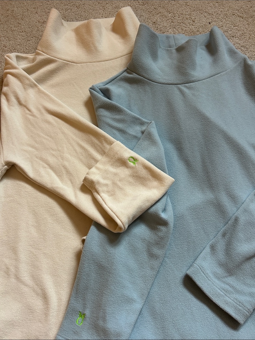 Dudley Stephen’s light blue and cream Cobble Hill Turtleneck fleeces